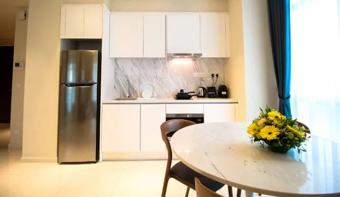 Executive Suite: Fully equipped kitchen with refrigerator and a marble dining table