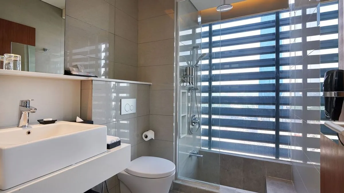 Duo Suite: Bathroom with a vanity basin and rain shower